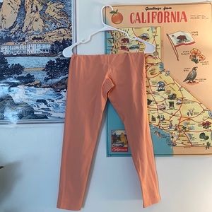 Girlfriend collective leggings in melon/pink